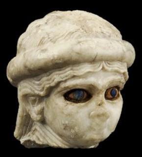 **Head of a high priestess(?) with inlaid eyes; from Ur (modern Tell el-Muqayyar); Akkadian period (ca. 2334-2154 BC), alabaster, shell, lapis lazuli, and bitumen; University of Pennsylvania Museum of Archaeology and Anthropology, B16228**